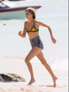 Cara Delevingne in Bikini Top on the beach in Barbados 2.jpg