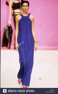 yves-saint-laurent-spring-summer-model-wearing-long-dark-blue-halterneck-CEJKD0.jpg