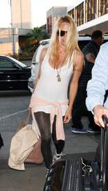 Pamela Anderson Arrives at Los Angeles International airport 16 April 2012  012.jpg
