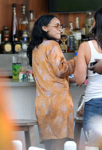 Rihanna-in-Mini-Dress-at-a-poolside-bar--08.jpg