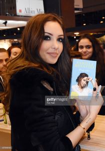 nabilla-benattia-poses-with-her-book-from-jai-lu-editions-during-trop-picture-id657838146.jpg