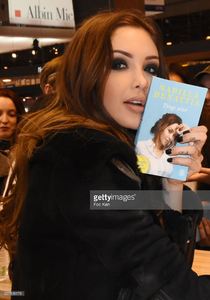 nabilla-benattia-poses-with-her-book-from-jai-lu-editions-during-trop-picture-id657838178.jpg