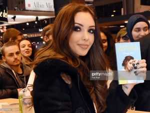 nabilla-benattia-poses-with-her-book-from-jai-lu-editions-during-trop-picture-id657838186.jpg