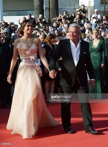 marine-lorphelin-and-actor-alain-delon-attend-the-premiere-of-zulu-picture-id169515120.jpg