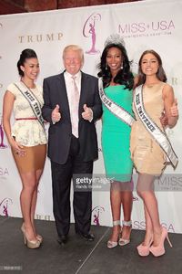 donald-trump-is-two-thumbs-up-while-surrounded-by-miss-teen-usa-logan-picture-id159181110.jpg