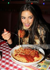 miss-universe-olivia-culpo-visits-buca-di-beppo-times-square-on-april-picture-id166556750.jpg