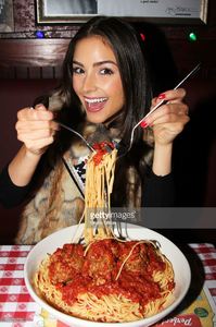 miss-universe-olivia-culpo-visits-buca-di-beppo-times-square-on-april-picture-id166556753.jpg