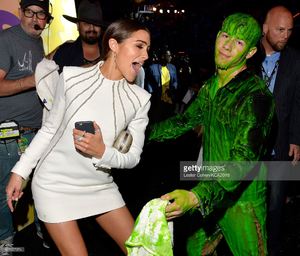 model-olivia-culpo-and-host-nick-jonas-after-getting-slimed-backstage-picture-id467957974.jpg