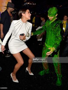 model-olivia-culpo-and-host-nick-jonas-after-getting-slimed-backstage-picture-id467957978.jpg