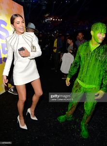 model-olivia-culpo-and-host-nick-jonas-after-getting-slimed-backstage-picture-id467964476.jpg