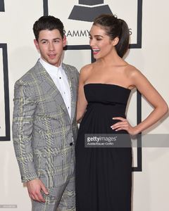 musician-nick-jonas-and-model-olivia-culpo-arrive-at-the-57th-annual-picture-id464098096.jpg
