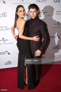 nick-jonas-and-olivia-culpo-arrive-for-the-universal-music-group-2015-picture-id463068548.jpg