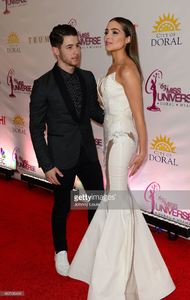 nick-jonas-and-olivia-culpo-attend-the-63rd-annual-miss-universe-red-picture-id462196404.jpg