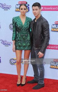 olivia-culpo-and-nick-jonas-arrive-at-the-2015-radio-disney-music-at-picture-id471177758.jpg