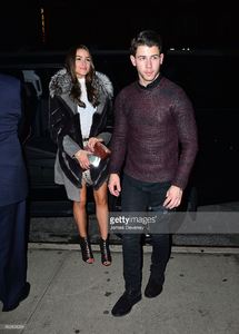olivia-culpo-and-nick-jonas-leave-taylor-swifts-25th-birthday-party-picture-id460404034.jpg