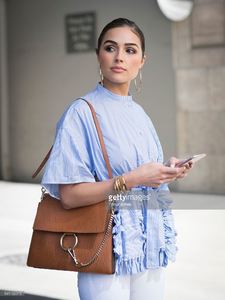 olivia-culpo-is-wearing-ports-1961-top-unravel-denim-chloe-bag-boots-picture-id541162016.jpg