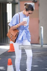 olivia-culpo-is-wearing-ports-1961-top-unravel-denim-chloe-bag-boots-picture-id541162056.jpg