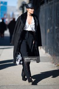 olivia-culpo-is-wearing-public-school-top-and-pants-eugenia-kim-hat-picture-id510290782.jpg