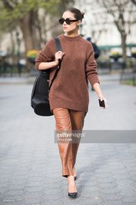 olivia-culpo-is-wearing-tibi-sweater-and-pants-marchesa-heels-celine-picture-id519456412.jpg