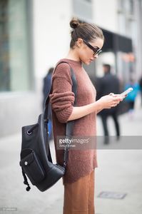 olivia-culpo-is-wearing-tibi-sweater-and-pants-marchesa-heels-celine-picture-id519456464.jpg