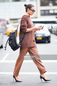 olivia-culpo-is-wearing-tibi-sweater-and-pants-marchesa-heels-celine-picture-id519456482.jpg
