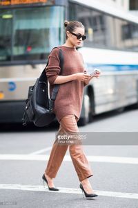 olivia-culpo-is-wearing-tibi-sweater-and-pants-marchesa-heels-celine-picture-id519456512.jpg