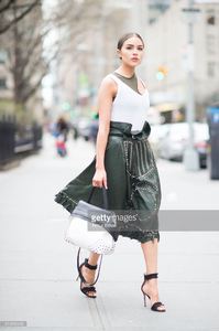 olivia-culpo-is-wearing-tods-skirt-and-bag-jbrand-tshirt-unravel-bra-picture-id519456428.jpg