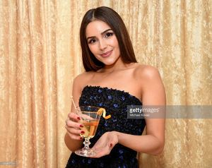 olivia-culpo-poses-with-the-signature-cocktail-for-the-2017-golden-picture-id630857534.jpg