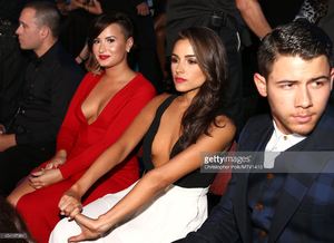 singer-demi-lovato-olivia-culpo-and-singer-nick-jonas-attend-the-2014-picture-id454107984.jpg