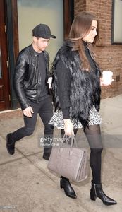singer-olivia-culpo-and-nick-jonas-are-seen-in-walking-in-soho-on-16-picture-id460585244.jpg
