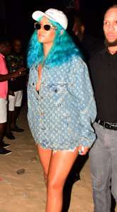 Rihanna--Wearing-a-turquoise-wig-at-a-carnival-event--05.jpg