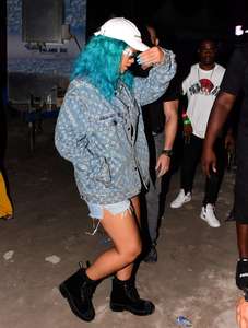 Rihanna--Wearing-a-turquoise-wig-at-a-carnival-event--06.jpg