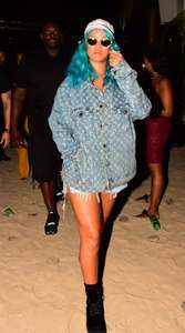 Rihanna--Wearing-a-turquoise-wig-at-a-carnival-event--08.jpg