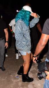 Rihanna--Wearing-a-turquoise-wig-at-a-carnival-event--11.jpg