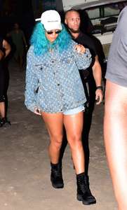 Rihanna--Wearing-a-turquoise-wig-at-a-carnival-event--12.jpg