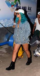 Rihanna--Wearing-a-turquoise-wig-at-a-carnival-event--13.jpg