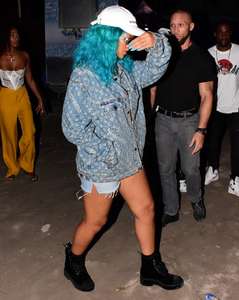 Rihanna--Wearing-a-turquoise-wig-at-a-carnival-event--14.jpg