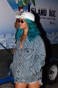 Rihanna--Wearing-a-turquoise-wig-at-a-carnival-event--18.jpg