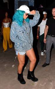 Rihanna--Wearing-a-turquoise-wig-at-a-carnival-event--19.jpg