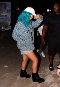 Rihanna--Wearing-a-turquoise-wig-at-a-carnival-event--20.jpg