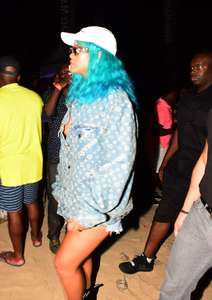 Rihanna--Wearing-a-turquoise-wig-at-a-carnival-event--23.jpg