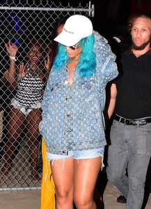 Rihanna--Wearing-a-turquoise-wig-at-a-carnival-event--25.jpg