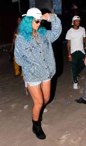 Rihanna--Wearing-a-turquoise-wig-at-a-carnival-event--31.jpg