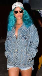 Rihanna--Wearing-a-turquoise-wig-at-a-carnival-event--33.jpg