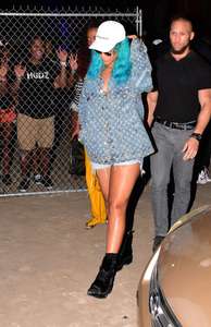 Rihanna--Wearing-a-turquoise-wig-at-a-carnival-event--36.jpg
