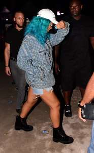 Rihanna--Wearing-a-turquoise-wig-at-a-carnival-event--40.jpg
