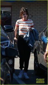 selena-gomez-grabs-breakfast-at-ihop-leaves-with-coffee-mug-11.jpg