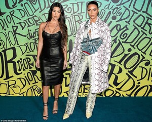 21791814-7753583-Taking_Miami_Kim_Kardashian_went_bold_in_head_to_toe_snakeskin_T-a-191_1575435142393.jpg