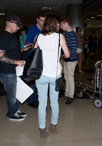 Lizzy-Caplan-in-Jeans-at-LAX--18.jpg