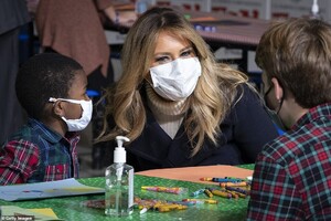 36608708-9030983-Melania_Trump_talks_with_with_children_as_they_make_Christmas_ca-a-45_1607460467651.jpeg